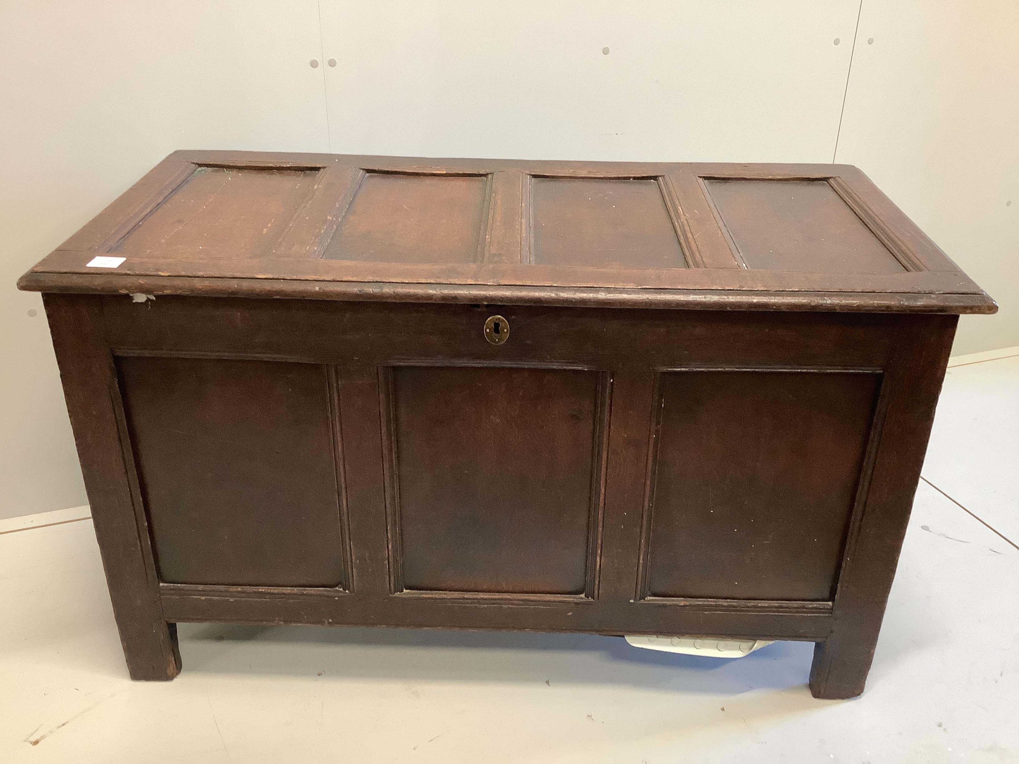 An early 18th century panelled oak coffer, width 126cm, depth 59cm, height 73cm